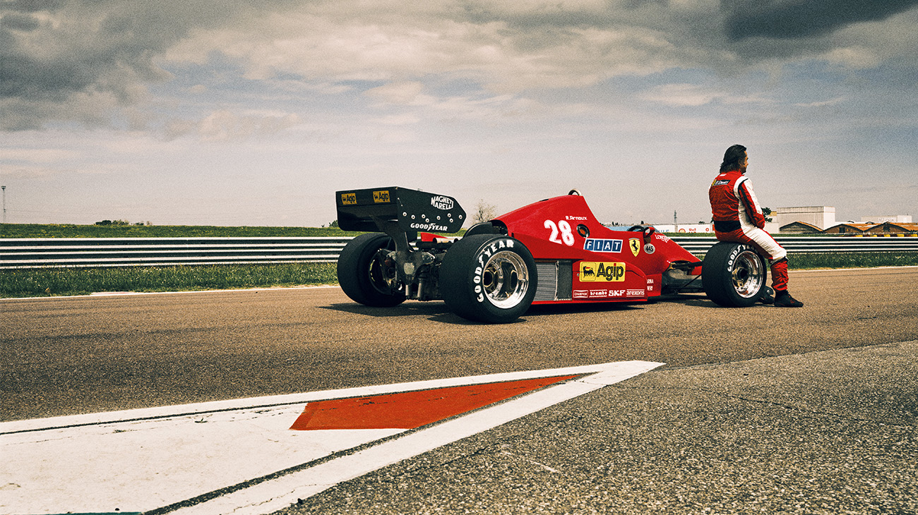 Riccardo Patrese and Elio de Angelis, sit on the tyres of the new