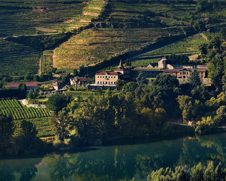 This 19th-century manor sits high on a hill overlooking vine-covered terraces with the Douro River gently flowing at its feet.