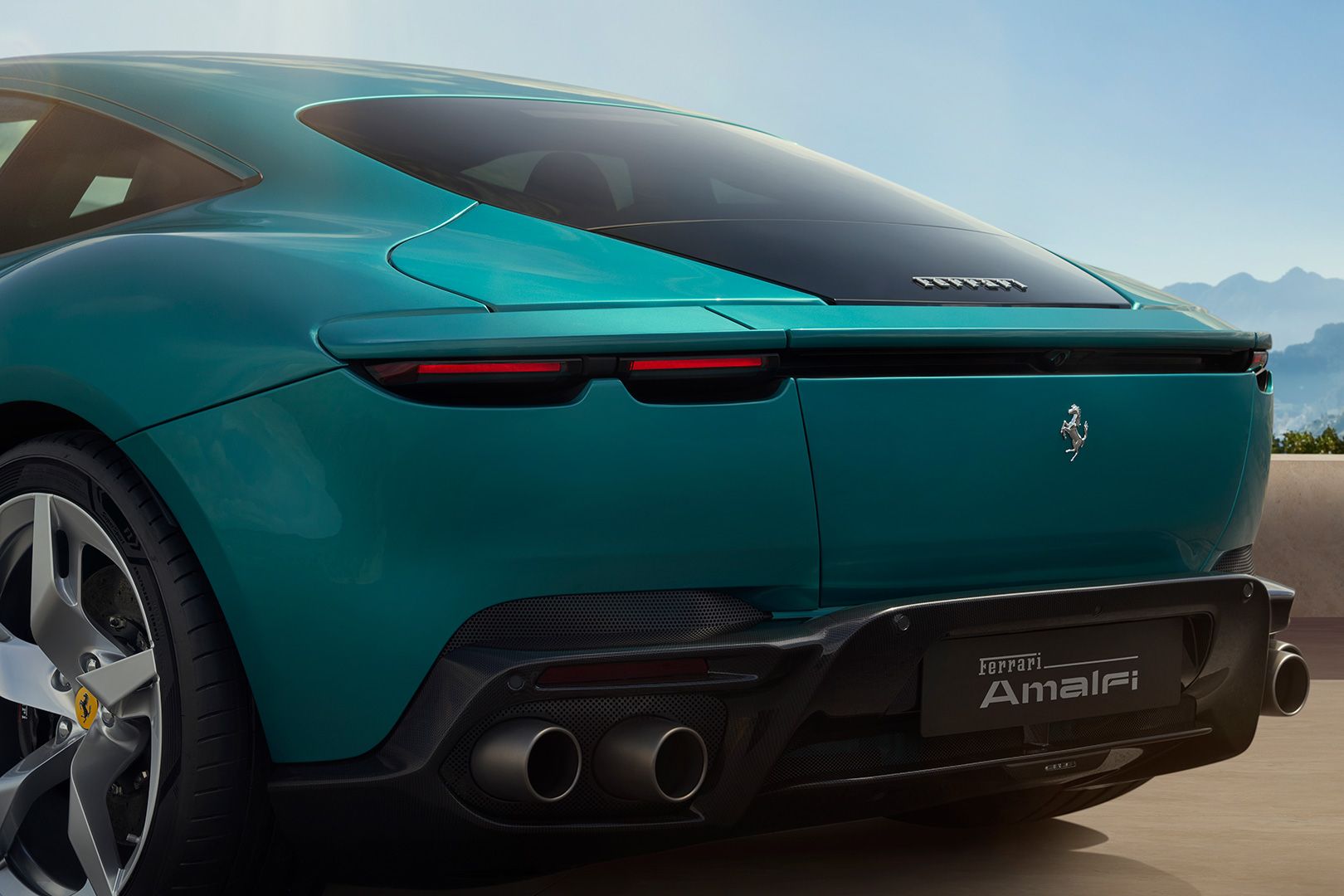Rear close-up of Ferrari Amalfi showing tail-lamps and quad exhausts